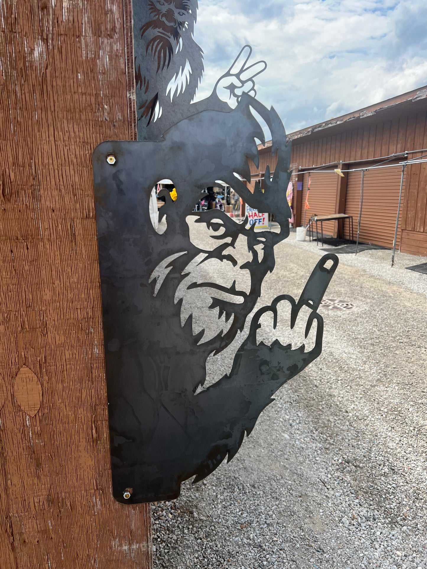 Peak a boo middle finger big foot fence hanger